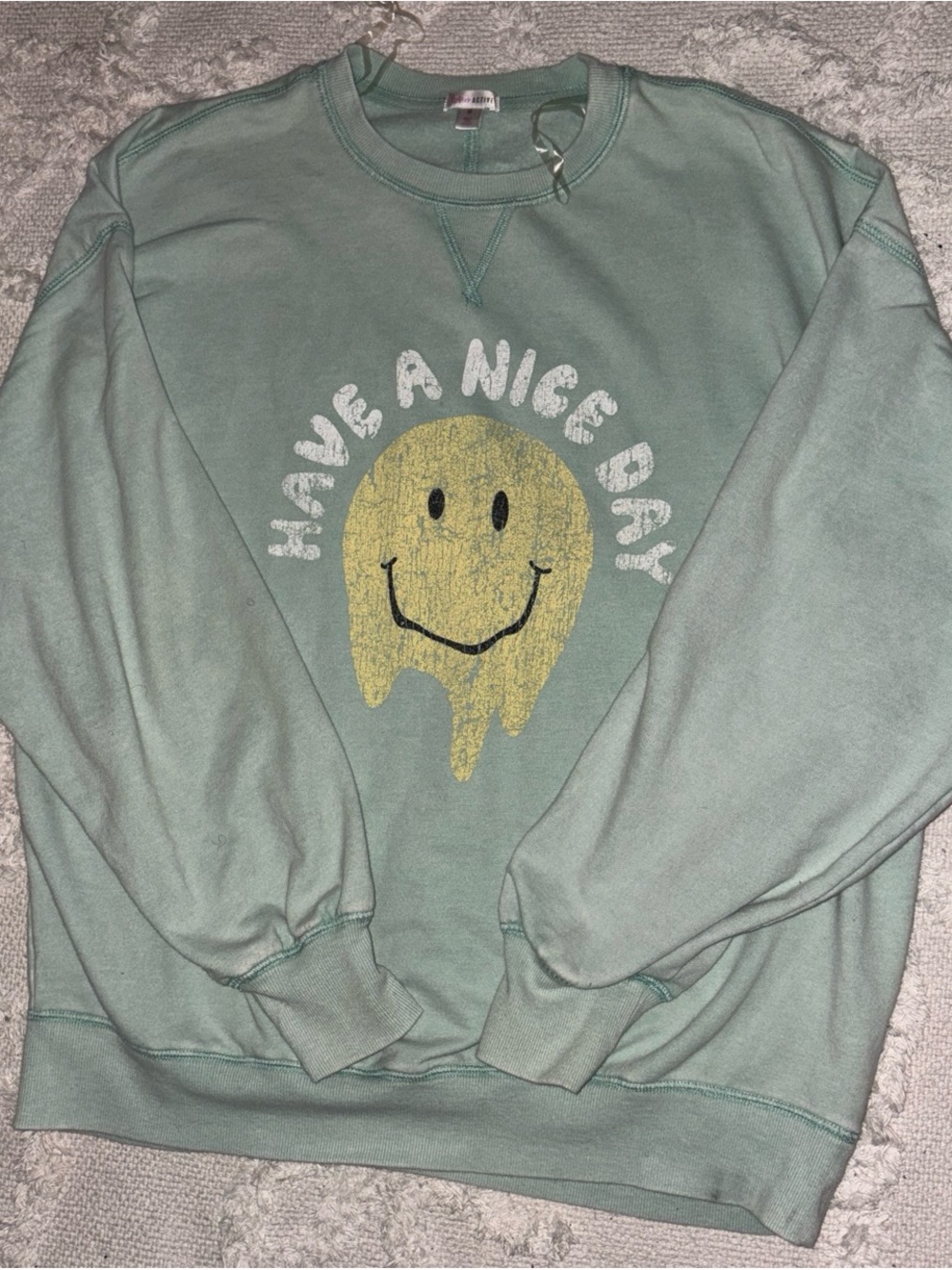 flirtitude Mint Green Crewneck with Distressed Yellow Smiley Graphic